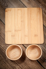 Wooden bowl on old wood background.