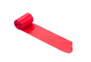 Red silk ribbon roll.