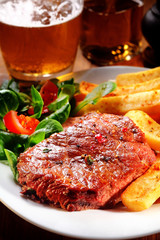 Flavored Beef Steak and Fries on Plate