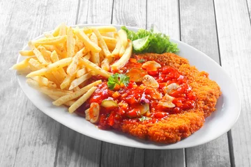 Fotobehang Crumbled Escalope with Sauce Paired with Fries © exclusive-design
