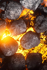 Hot charcoal and glowing coals on a barbecue