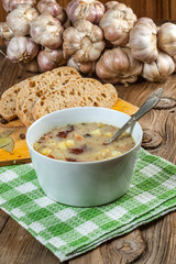 Sour soup with bread.