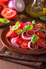 healthy tomato salad with onion basil olive oil and balsamic vin