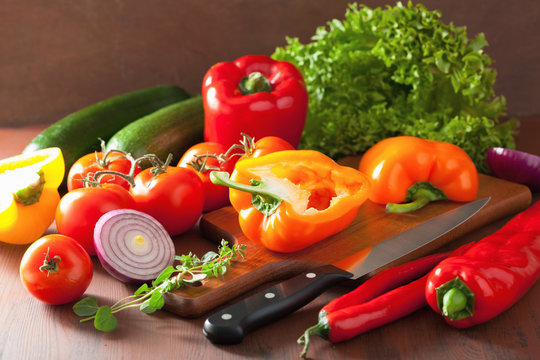 chopping healthy vegetables pepper tomato salad onion chilli on