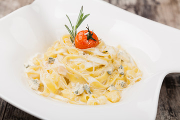 pasta with dorblue cheese on a white plate