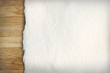 Old white paper on wooden background