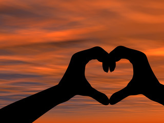Conceptual heart shape sunset silhouette