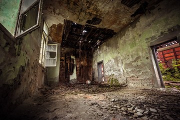 Dark room interior with damaged roof