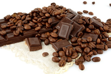 Studio shot of chocolates and beans of coffee