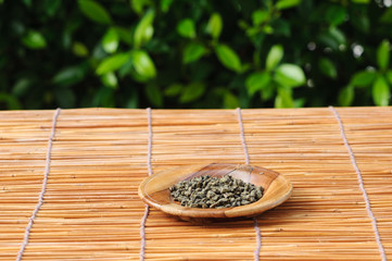 Dry herb tea on wood plate