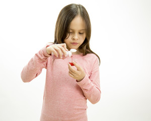Young girl pouring and taking medicine