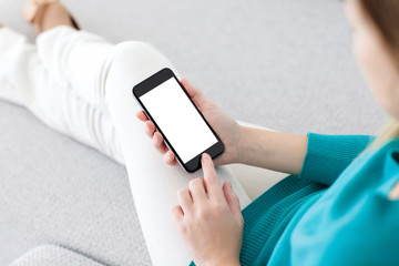 girl sitting and holding a phone with isolated screen
