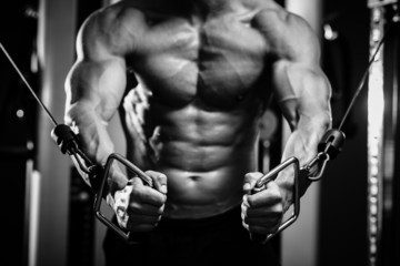Fototapeta na wymiar bodybuilder guy in gym hands close up