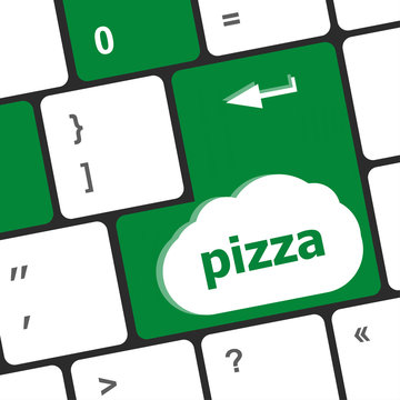 Computer keyboard with blue pizza word on enter key,