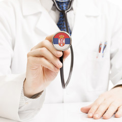 Doctor holding stethoscope with flag series - Serbia