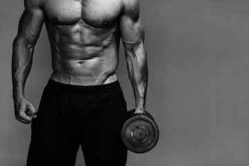 Fototapeta na wymiar muscular bodybuilder guy close up monochrome