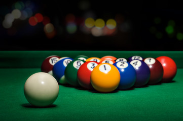 Pool game balls against a green
