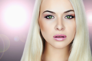 Fototapeta premium Young Beautiful blond woman.Beauty Girl.make-up.flashlights
