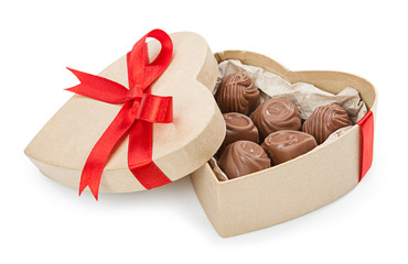 Chocolate candy in a box with a red bow