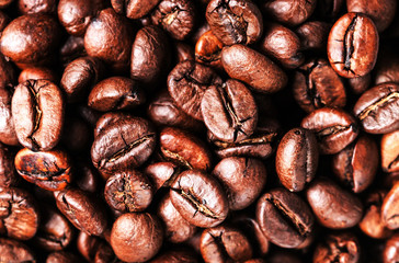 Brown coffee beans. Roasted coffee beans for background and text