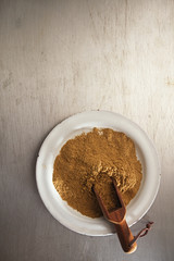 coriander powder in vintage enamelled plate