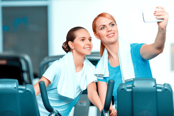 Cute teenage girl and her mom at sports club