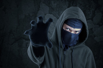 Robber with mask catching something