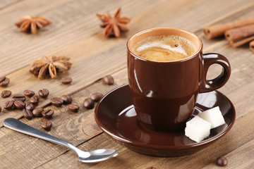 brown coffee cup on the background of wooden planks