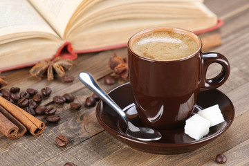 brown coffee cup r on the background of wooden planks