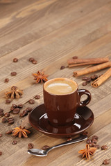 brown coffee cup r on the background of wooden planks