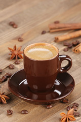 brown coffee cup r on the background of wooden planks