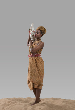 Attractive Young African Woman Carrying Jug With Water