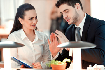 Beautiful young businesspeople having a lunch