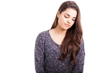 Young woman looking miserable