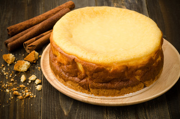 Cheesecake (New York cheesecake) on wooden background