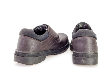 Old black safety shoe for worker