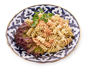 Penne pasta with sauce, cheese and basil, selective focus