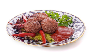 Meat on a grill with vegetables