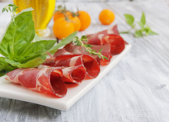 fresh beef cuts, carpaccio, with vegetables and basil