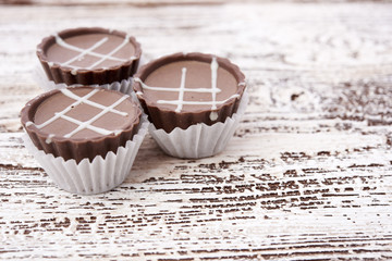 Dark chocolate on wooden background