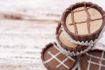 Dark chocolate on wooden background