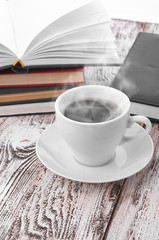 Cup of coffee on a wooden table