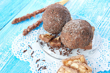 Cupcake with chocolate on wooden background