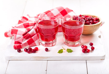 glasses of cranberry juice with fresh berries