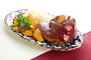 Meat on a grill with vegetables