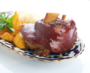 Meat on a grill with vegetables