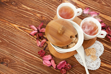 tea with sugar cubes on wooden
