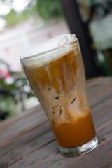 Iced coffee with milk is on the table.