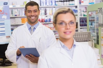 Obraz premium pharmacists looking at camera