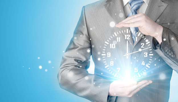 Image of businessman holding clock against illustration
